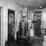 Homemade booze machine raid in Brooklyn, 1927.